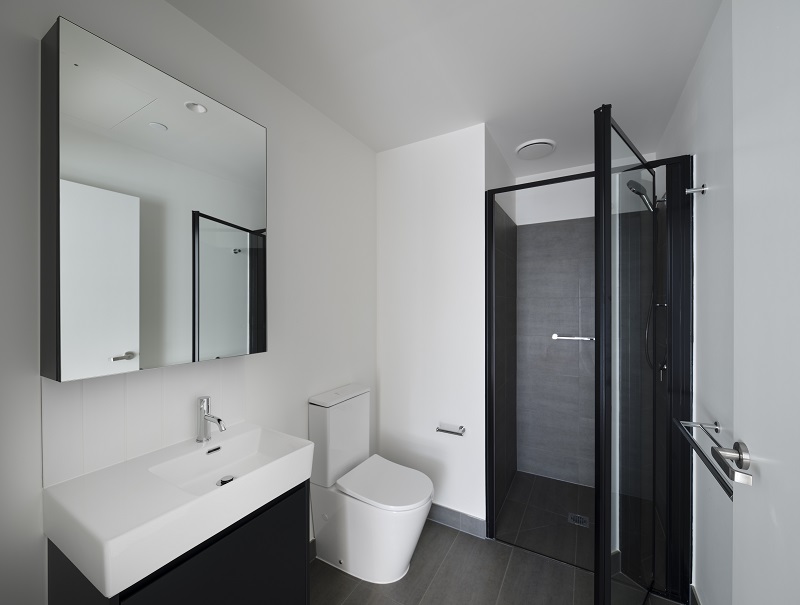 Image modern bathroom with large vanity and sink and toilet