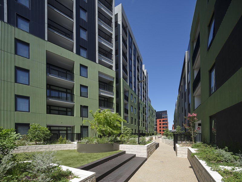 Path with a new apartment building on either side